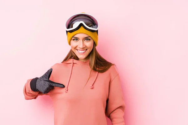 Young Caucasian Woman Wearing Ski Clothes Isolated Person Pointing Hand — 스톡 사진
