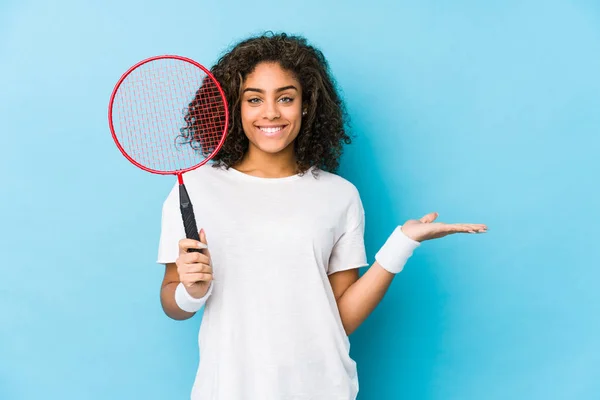 Young African American Woman Playing Badminton Showing Copy Space Palm — ストック写真
