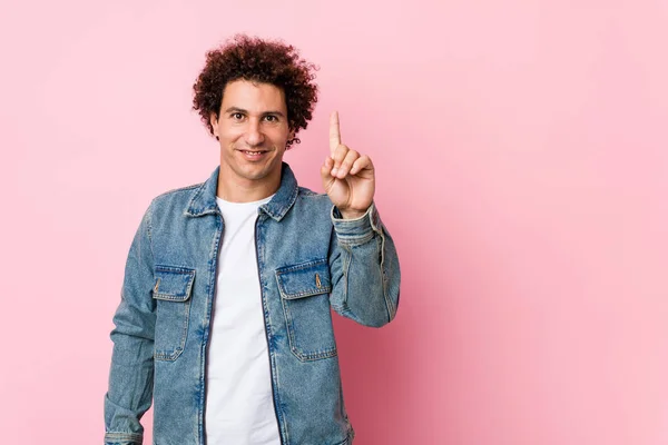 Curly Mature Man Wearing Denim Jacket Pink Background Showing Number — 스톡 사진