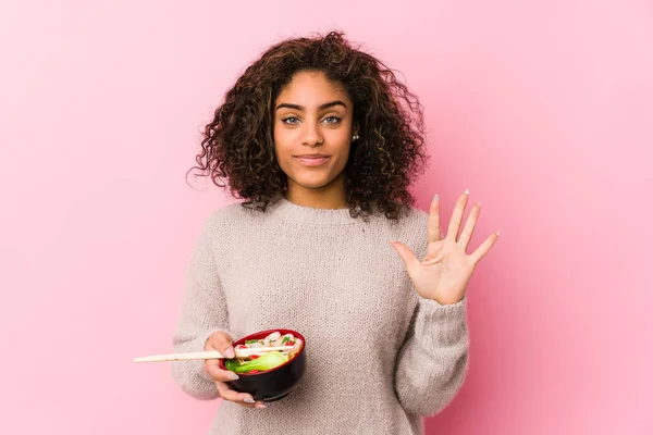 Young African American Woman Eating Noodles Smiling Cheerful Showing Number — Stock Photo, Image