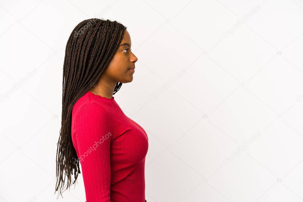 Young african american woman isolated gazing left, sideways pose.