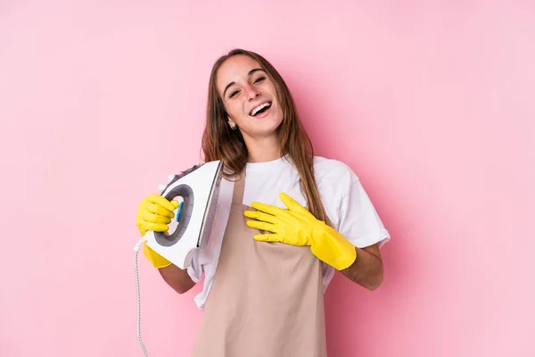 Young Caucasian Woman Clothes Iron Isolated Laughs Out Loudly Keeping — Stock Photo, Image