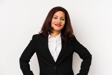 Middle age latin business woman isolated confident keeping hands on hips.