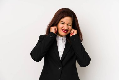 Middle age latin business woman isolated covering ears with hands.