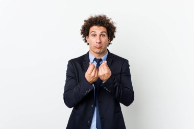 Young business curly man against white background showing that she has no money.