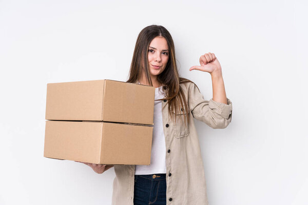 Young caucasian woman moving to a new home feels proud and self confident, example to follow.