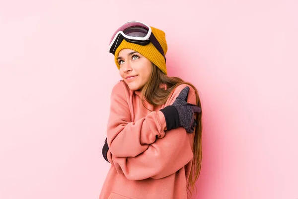 Young Caucasian Woman Wearing Ski Clothes Isolated Hugs Smiling Carefree — 스톡 사진