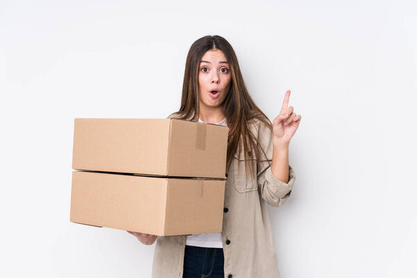 Young caucasian woman moving to a new home having some great idea, concept of creativity.