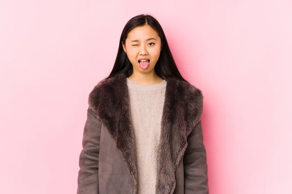 Young Chinese Woman Wearing Coat Isolated Funny Friendly Sticking Out — 스톡 사진