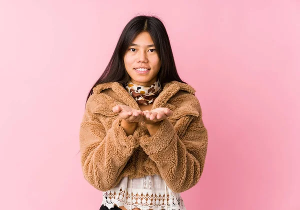 Young Asian Woman Holding Something Palms Offering Camera — 스톡 사진