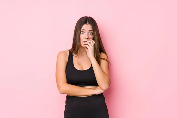 Young Fitness Caucasian Woman Isolated Biting Fingernails Nervous Very Anxious — Stock Photo, Image