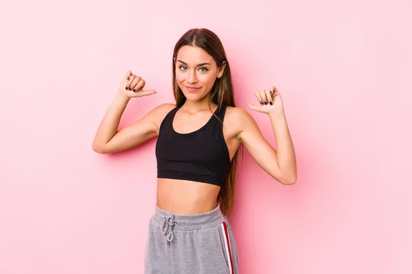 Young Caucasian Fitness Woman Posing Pink Background Feels Proud Self — Stok fotoğraf