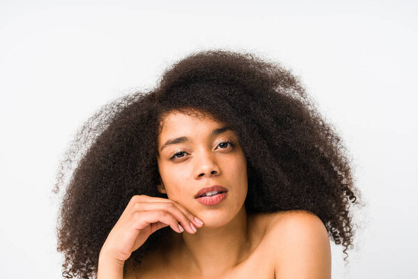 Young afro woman face close up isolated
