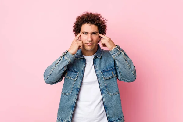 Curly Mature Man Wearing Denim Jacket Pink Background Focused Task — 스톡 사진