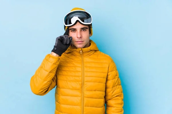 Young Skier Man Wearing Snowboard Goggles Isolated Pointing Temple Finger — ストック写真