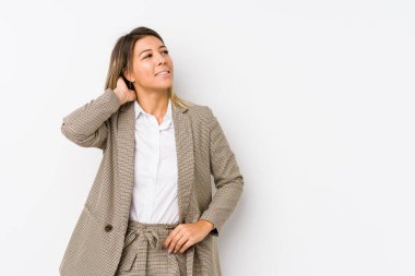Young caucasian business woman isolated touching back of head, thinking and making a choice.