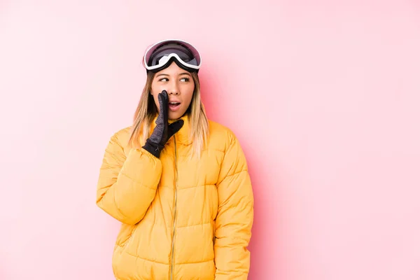 Young Caucasian Woman Wearing Ski Clothes Pink Background Saying Secret — 스톡 사진
