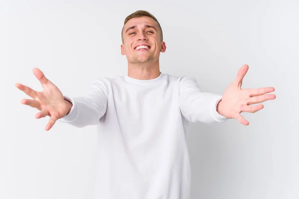 Young Caucasian Man White Background Feels Confident Giving Hug Camera — 스톡 사진