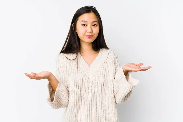 Young Chinese Woman Isolated Doubting Shrugging Shoulders Questioning Gesture — Stok fotoğraf