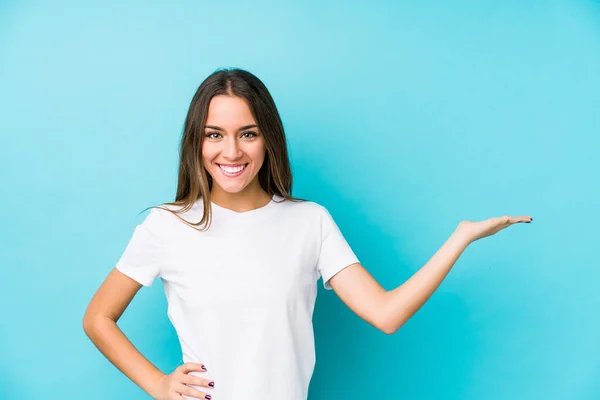 Young Caucasian Woman Isolated Showing Copy Space Palm Holding Another — Stock Photo, Image