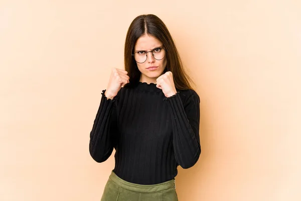 Young Caucasian Woman Isolated Beige Background Showing Fist Camera Aggressive — Stock Photo, Image