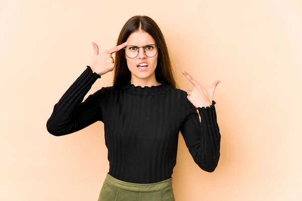 Young Caucasian Woman Isolated Beige Background Showing Disappointment Gesture Forefinger — Stock Photo, Image