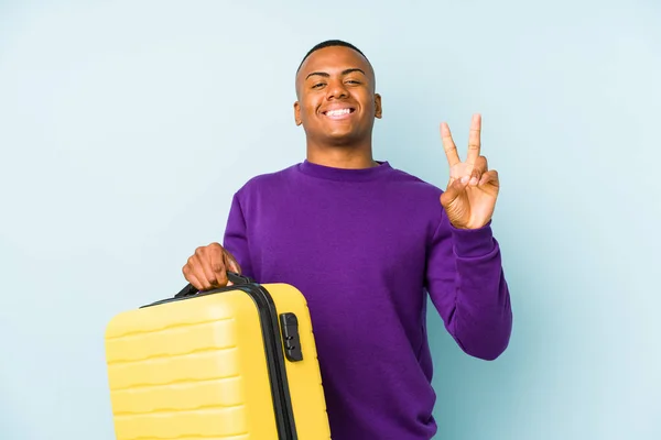 Young Traveler Man Holding Suitcase Isolated Showing Number Two Fingers — Stock Photo, Image
