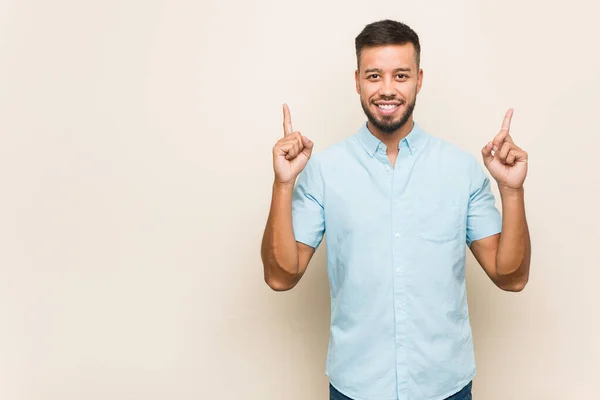 Young South Asian Man Indicates Both Fore Fingers Showing Blank — Stock Photo, Image