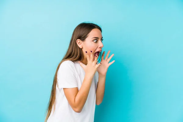 Young Caucasian Woman Isolated Shouts Loud Keeps Eyes Opened Hands — Stock Photo, Image