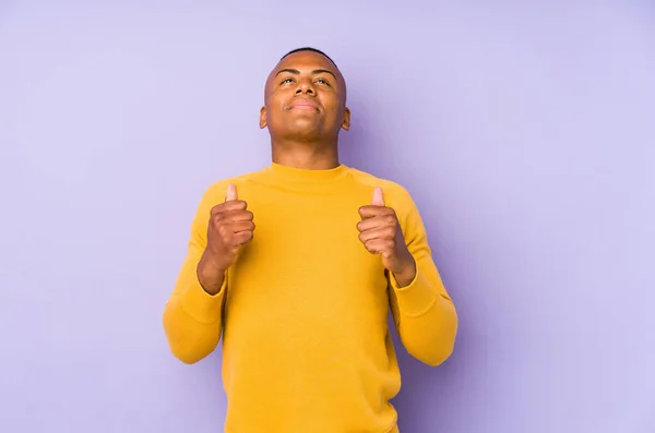 Young Latin Man Isolated Purple Background Raising Fist Feeling Happy — Stok fotoğraf