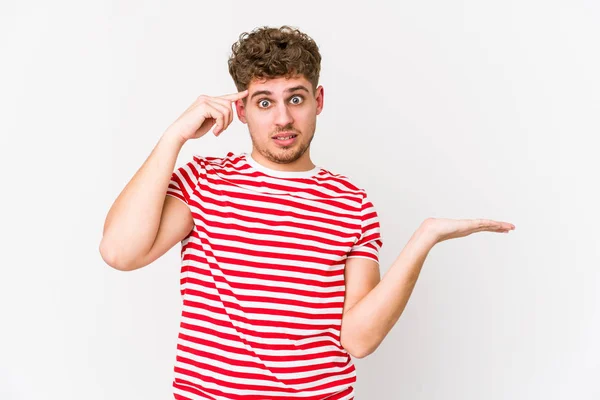 Young Blond Curly Hair Caucasian Man Isolated Holding Showing Product — Stock Photo, Image