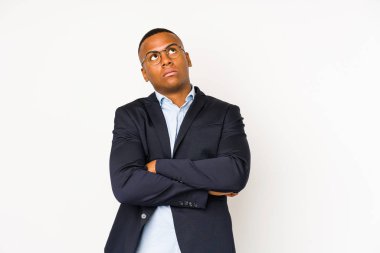 Young business latin man isolated on white background tired of a repetitive task.