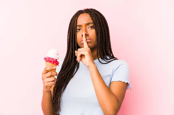 Young African American Woman Holding Ice Cream Isolated Keeping Secret — Zdjęcie stockowe