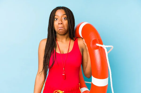 Young African American Life Guard Woman Isolated Shrugs Shoulders Open — Stock Photo, Image