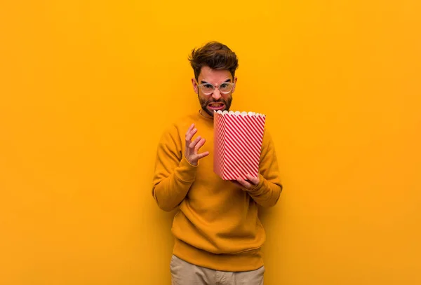 Young Man Holding Popcorns Angry Upset — Stock Photo, Image