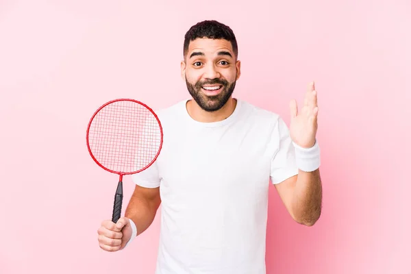 Young Arabian Man Playing Badminton Isolated Receiving Pleasant Surprise Excited — Stock Photo, Image