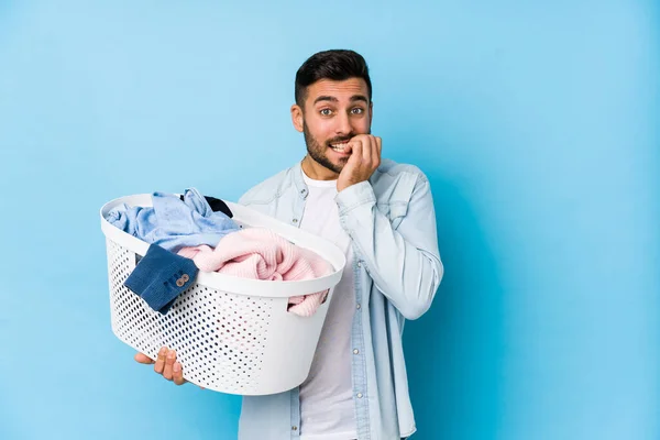 Young Handsome Man Doing Laundry Isolated Biting Fingernails Nervous Very — Stockfoto
