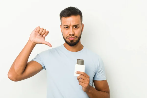 Young South Asian Man Holding Shave Cream Showing Dislike Gesture — Stock Photo, Image