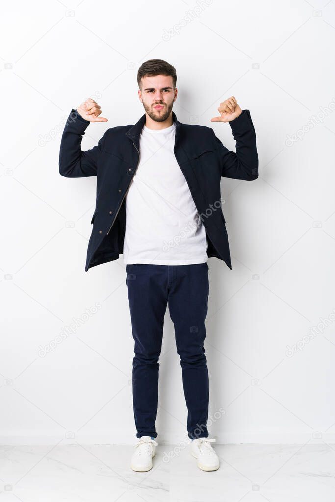 Full body young caucasian man isolated feels proud and self confident, example to follow.