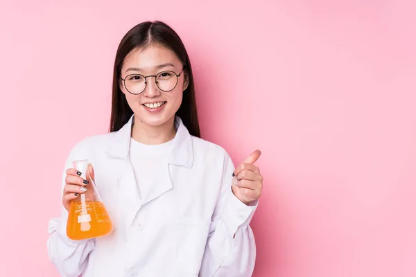 Young chinese scientific woman isolated smiling and raising thumb up