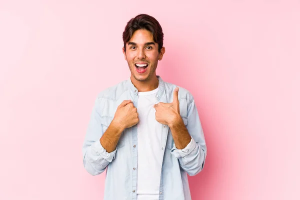 Young Caucasian Man Posing Pink Background Isolated Surprised Pointing Finger — Stock Photo, Image