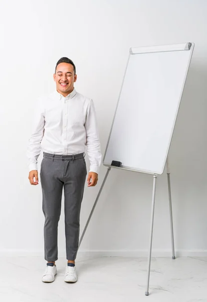 Young Latin Coaching Man Whiteboard Isolated Laughs Closes Eyes Feels — Stock Photo, Image