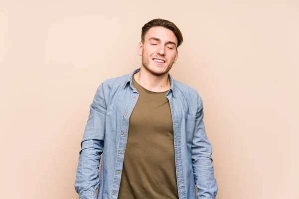 Young Caucasian Man Posing Isolated Laughs Closes Eyes Feels Relaxed — 图库照片