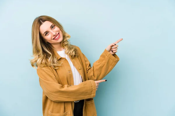 Young Blonde Pretty Woman Isolated Excited Pointing Forefingers Away — Stock Photo, Image