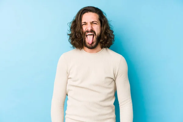 Young Long Hair Man Isolated Blue Background Funny Friendly Sticking — Stock Photo, Image
