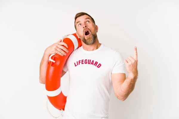Senior Lifeguard Man Isolated White Background Pointing Upside Opened Mouth — 스톡 사진