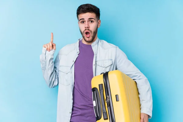 Young Caucasian Traveler Man Holding Suitcase Isolated Having Some Great — Stock Photo, Image
