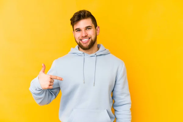 Young Caucasian Man Isolated Yellow Background Person Pointing Hand Shirt — Stock Photo, Image