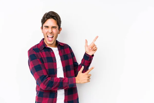 Young Caucasian Man Posing Pink Background Isolated Pointing Forefingers Copy — 스톡 사진