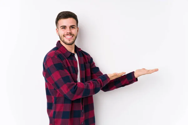 Young Caucasian Man Posing White Background Isolated Holding Copy Space — Stock Photo, Image